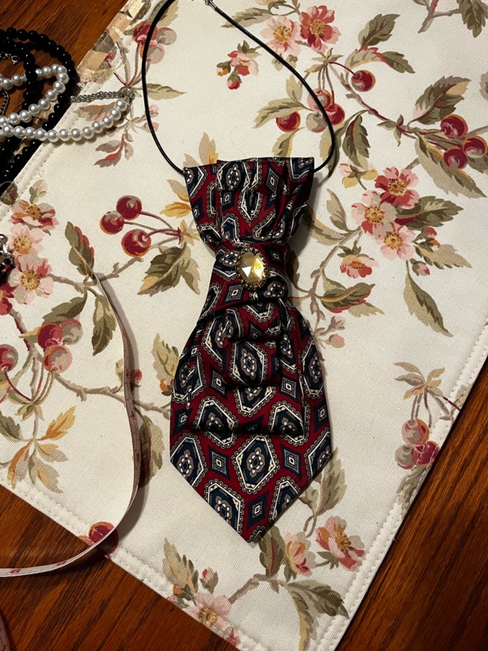 Vintage-Inspired Red Paisley Neck Accessory with Jewel Accent